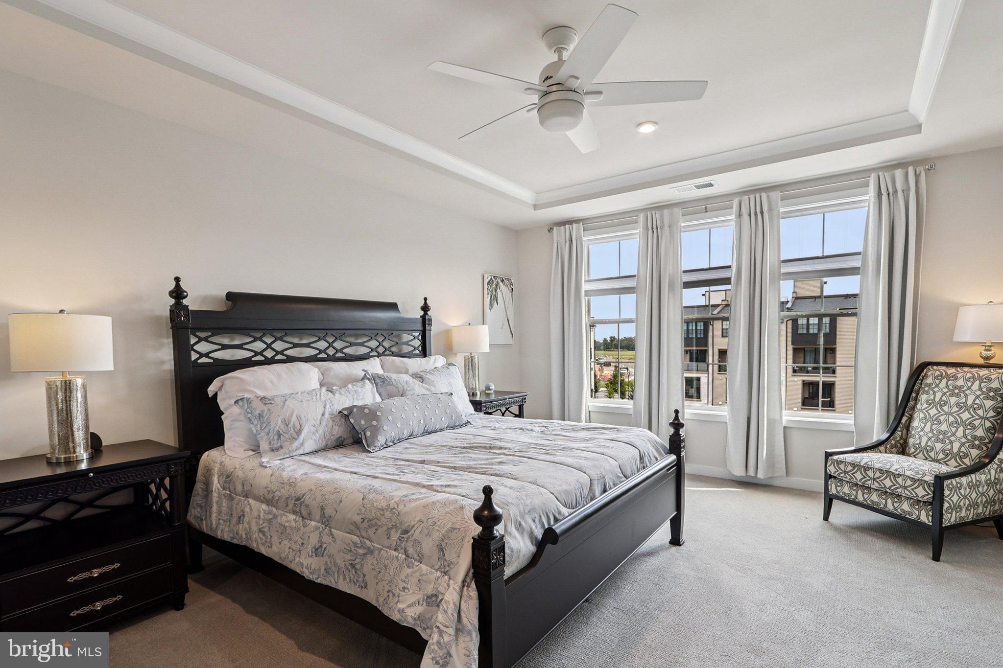 22381 Roanoke Rise Terrace Ashburn, VA 20148 - Photo 31 of 69 a bedroom with a bed a couch and a window
