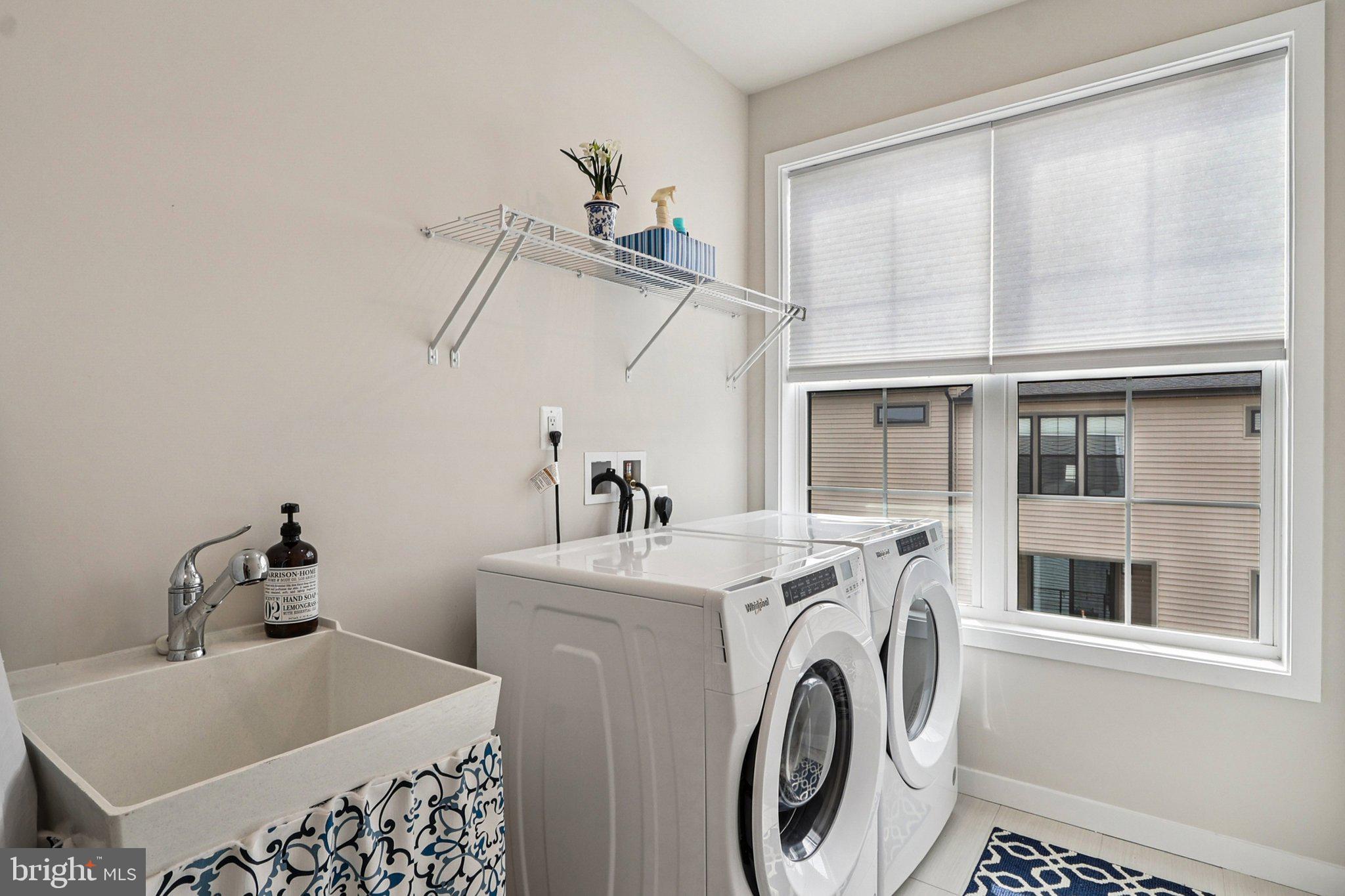 22381 Roanoke Rise Terrace Ashburn, VA 20148 - Photo 37 of 69 a view of a storage & utility room with dryer and washer