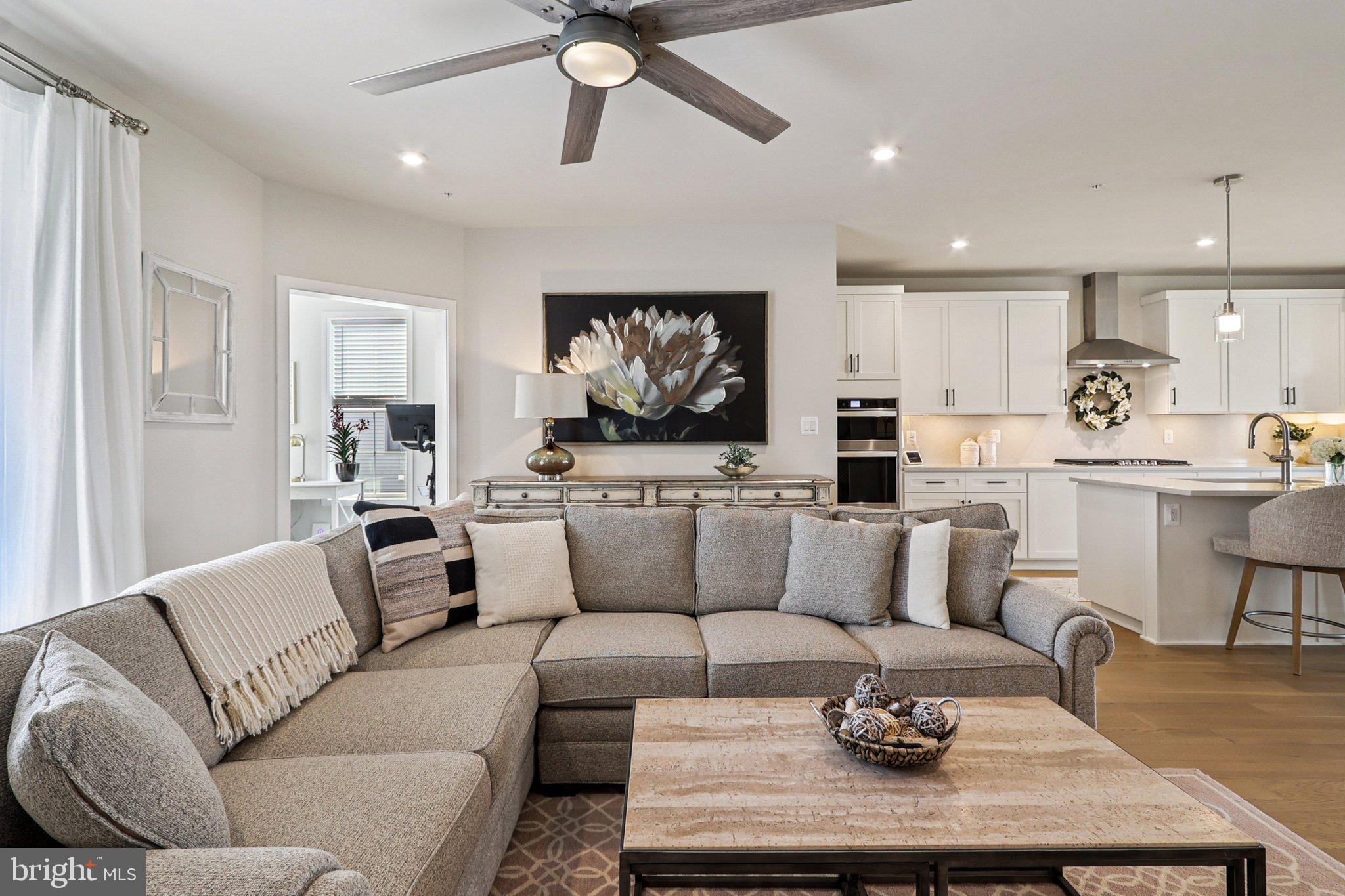 22381 Roanoke Rise Terrace Ashburn, VA 20148 - Photo 4 of 69 a living room with furniture kitchen view and a large window
