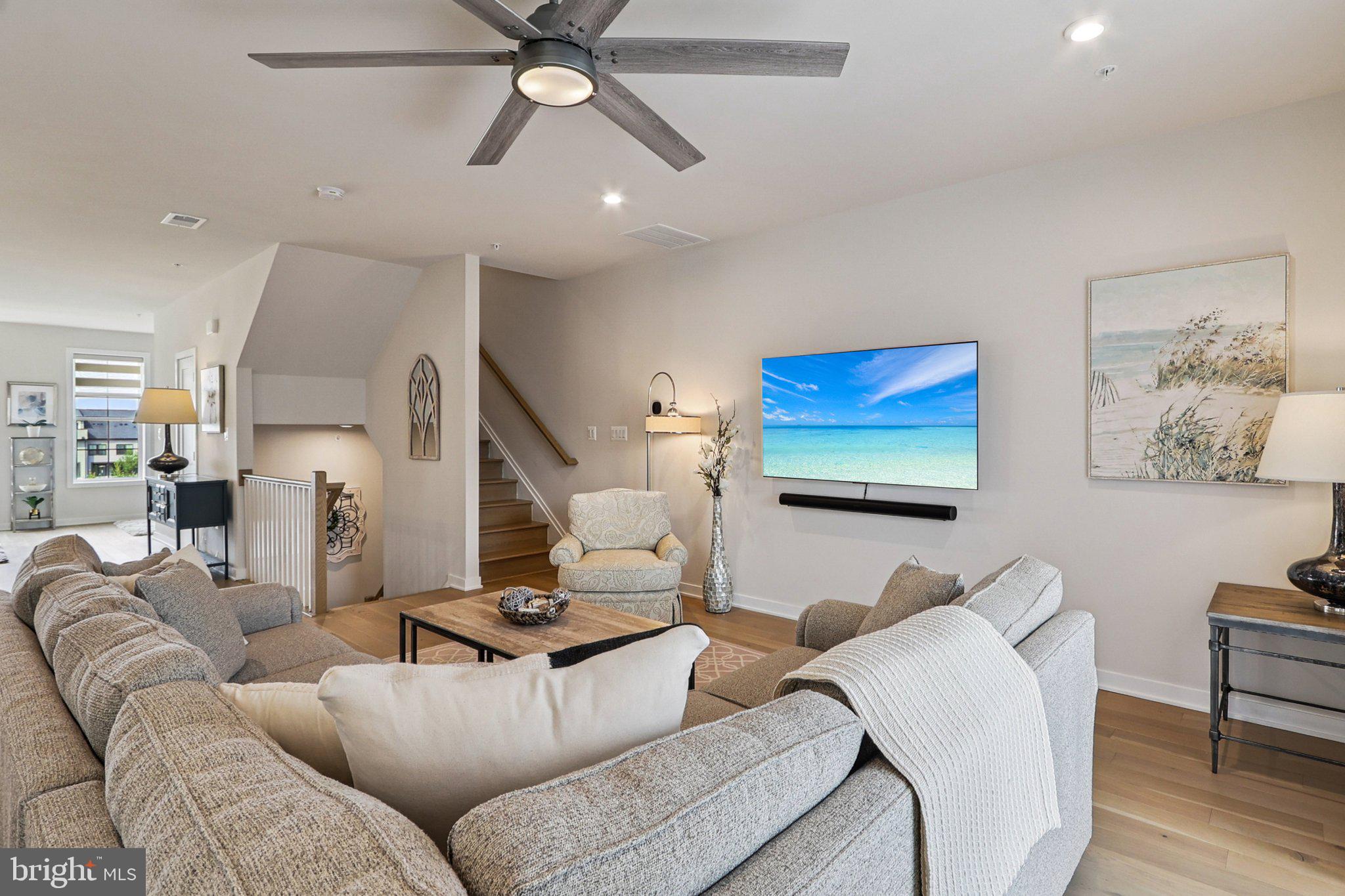 22381 Roanoke Rise Terrace Ashburn, VA 20148 - Photo 5 of 69 a living room with furniture and a flat screen tv