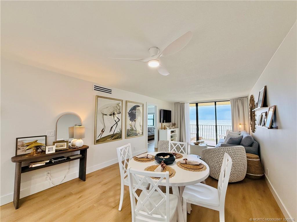 7370 South Ocean Drive, Unit 312 Jensen Beach, FL 34957 - Photo 19 of 67 a living room with furniture and a wooden floor