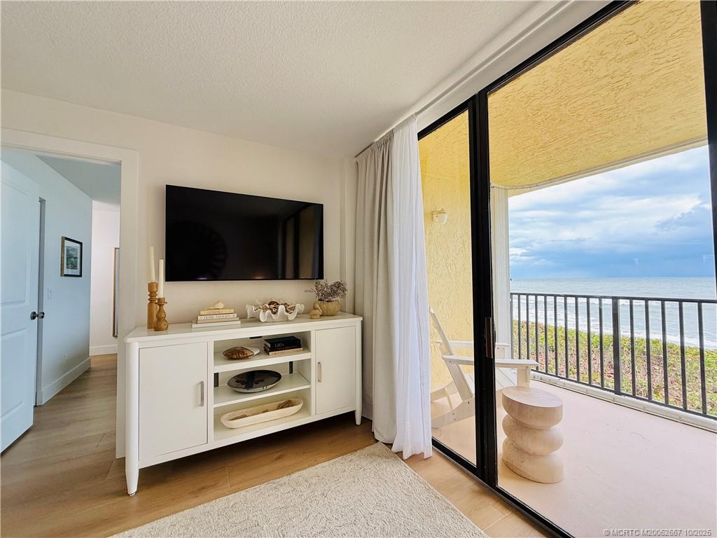 7370 South Ocean Drive, Unit 312 Jensen Beach, FL 34957 - Photo 30 of 67 a view of living room with flat screen tv