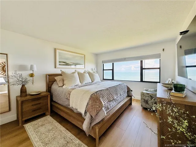 a bedroom with a bed and a sink