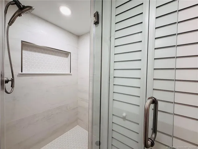 a bedroom with a bed and dresser