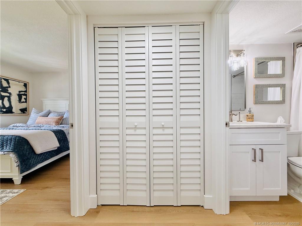 7370 South Ocean Drive, Unit 312 Jensen Beach, FL 34957 - Photo 48 of 67 a bedroom with a bed and a sink