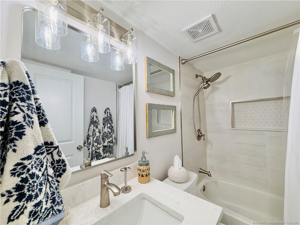 7370 South Ocean Drive, Unit 312 Jensen Beach, FL 34957 - Photo 50 of 67 a bathroom with a bathtub and shower
