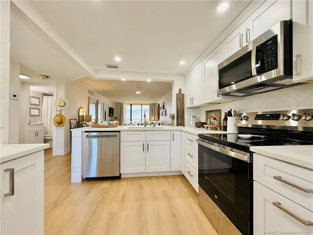 a kitchen with counter top space and cabinets