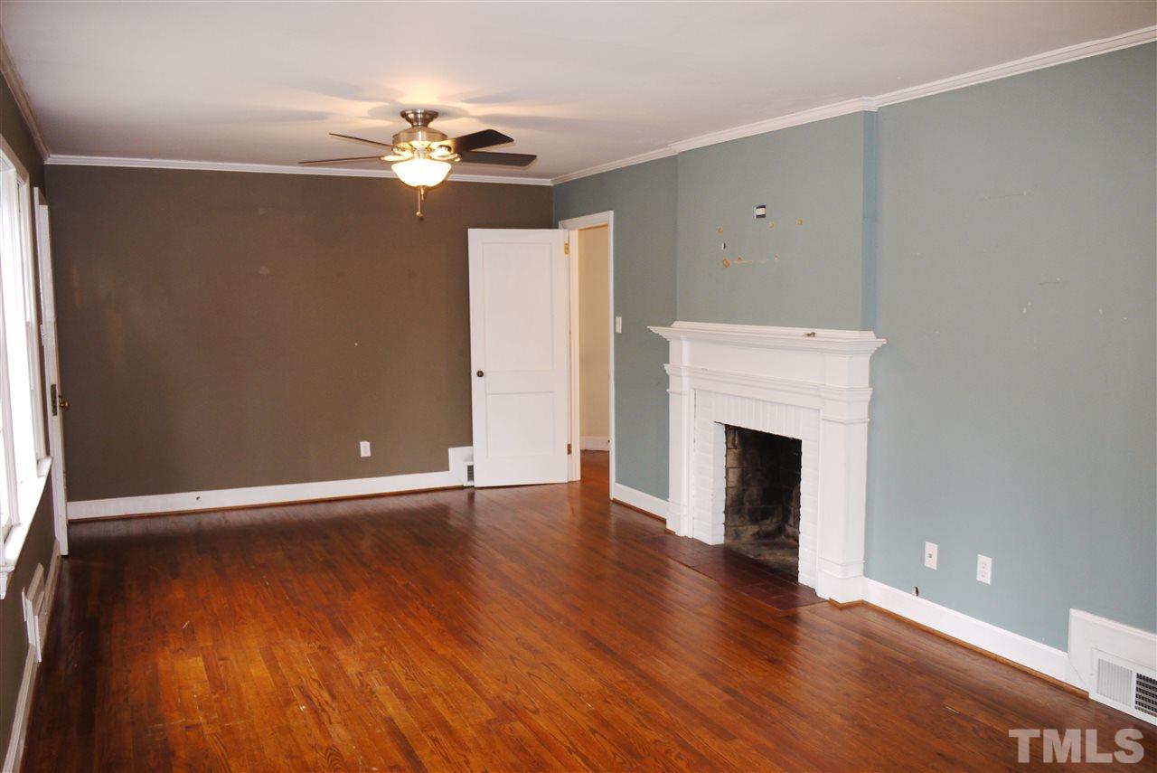 1517 Duplin Road Raleigh, NC 27607 - Photo 3 of 10 a view of an empty room with wooden floor and a window