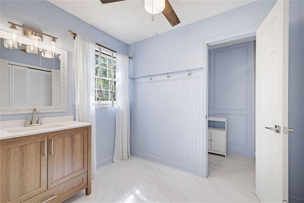 2845 Wood Forest Road Marietta, GA 30066 - Photo 14 of 26 a bathroom with a sink and a mirror