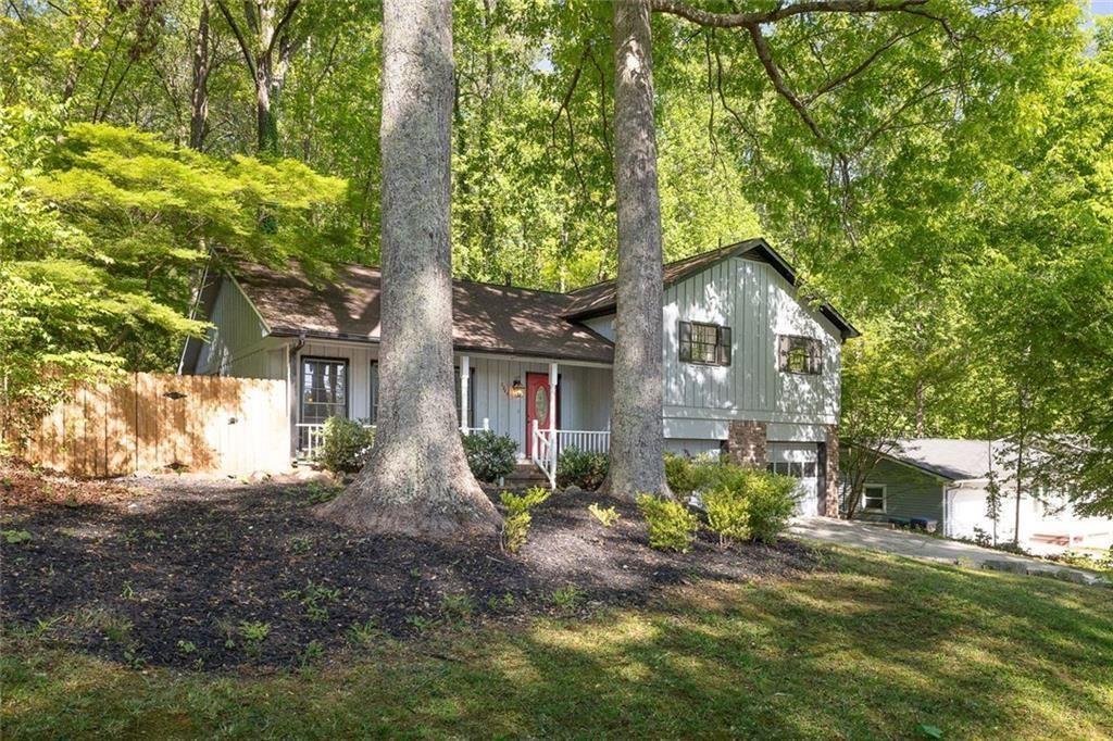 2845 Wood Forest Road Marietta, GA 30066 - Photo 2 of 26 a front view of a house with garden