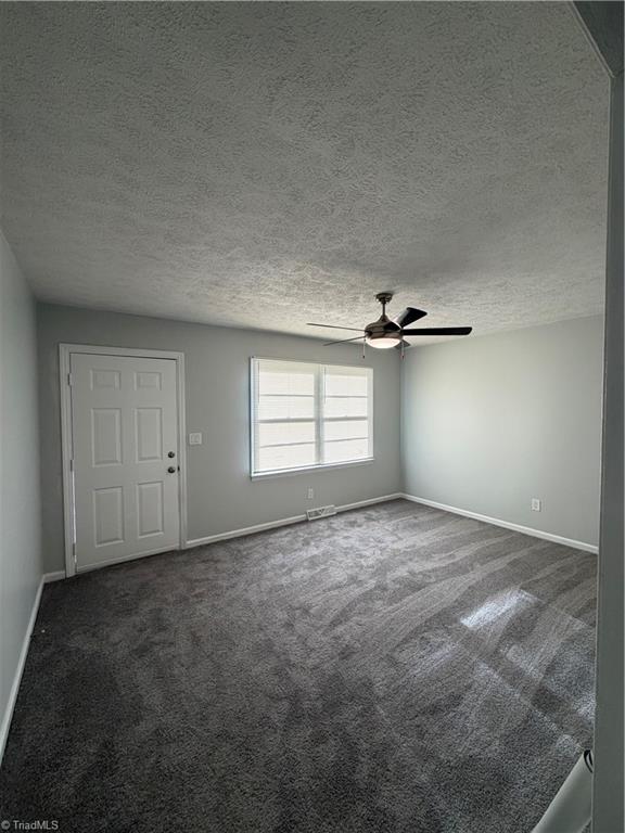 2387 Ashley Loop Reidsville, NC 27320 - Photo 7 of 21 Livingroom …this door is the front door and this is the view from the kitchen