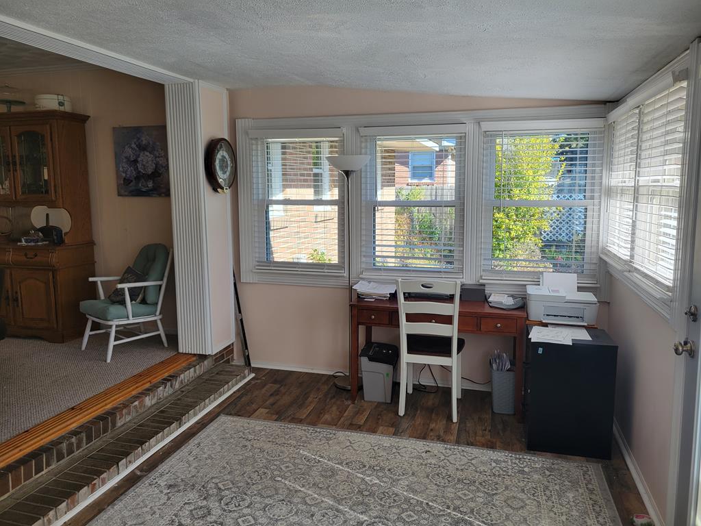 4202 Cheshire Bridge Road Columbus, GA 31909 - Photo 18 of 47 a view of a workspace with furniture and a window