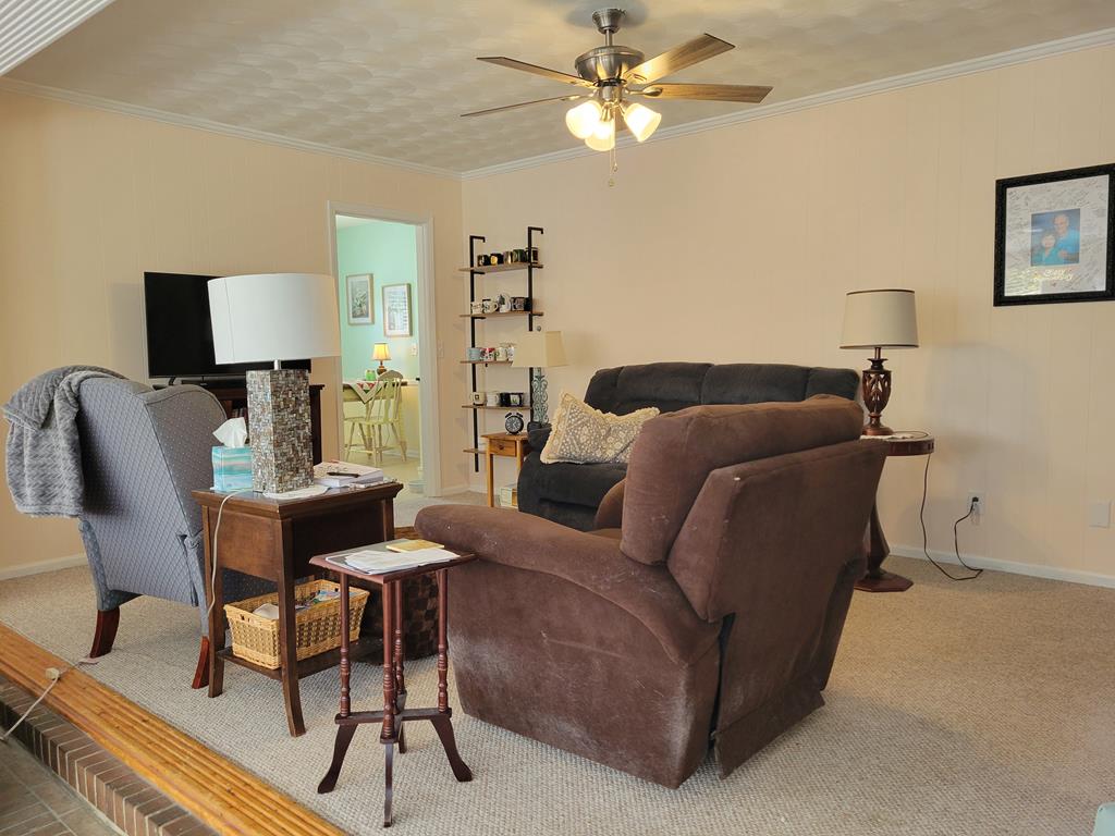 4202 Cheshire Bridge Road Columbus, GA 31909 - Photo 20 of 47 a living room with furniture a couch and a lamp