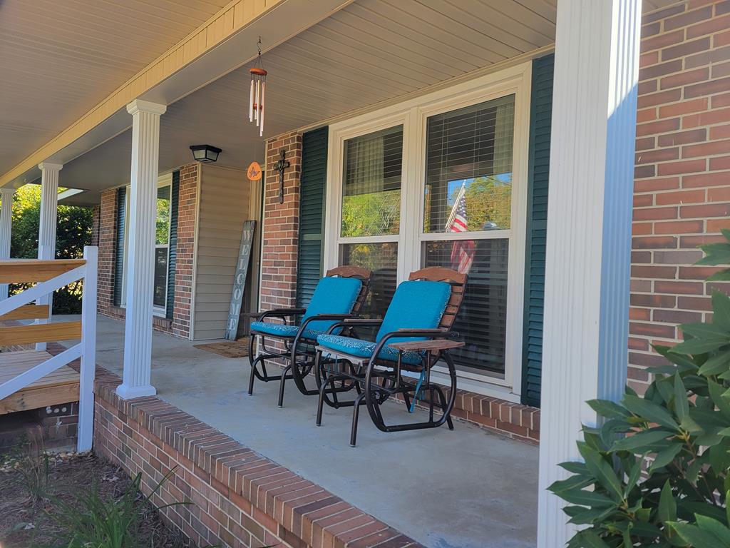 4202 Cheshire Bridge Road Columbus, GA 31909 - Photo 2 of 47 a view of a house with porch and sitting area
