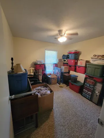 a living room with furniture and a lamp