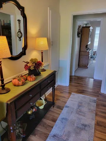 a room with furniture and wooden floor