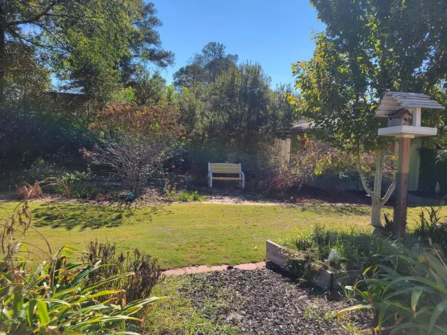 a view of a balcony with wooden floor