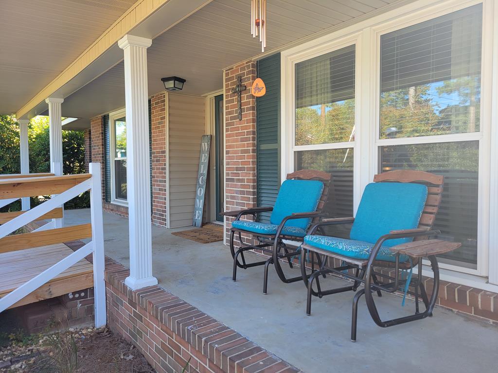 4202 Cheshire Bridge Road Columbus, GA 31909 - Photo 45 of 47 a balcony with furniture and a potted plant