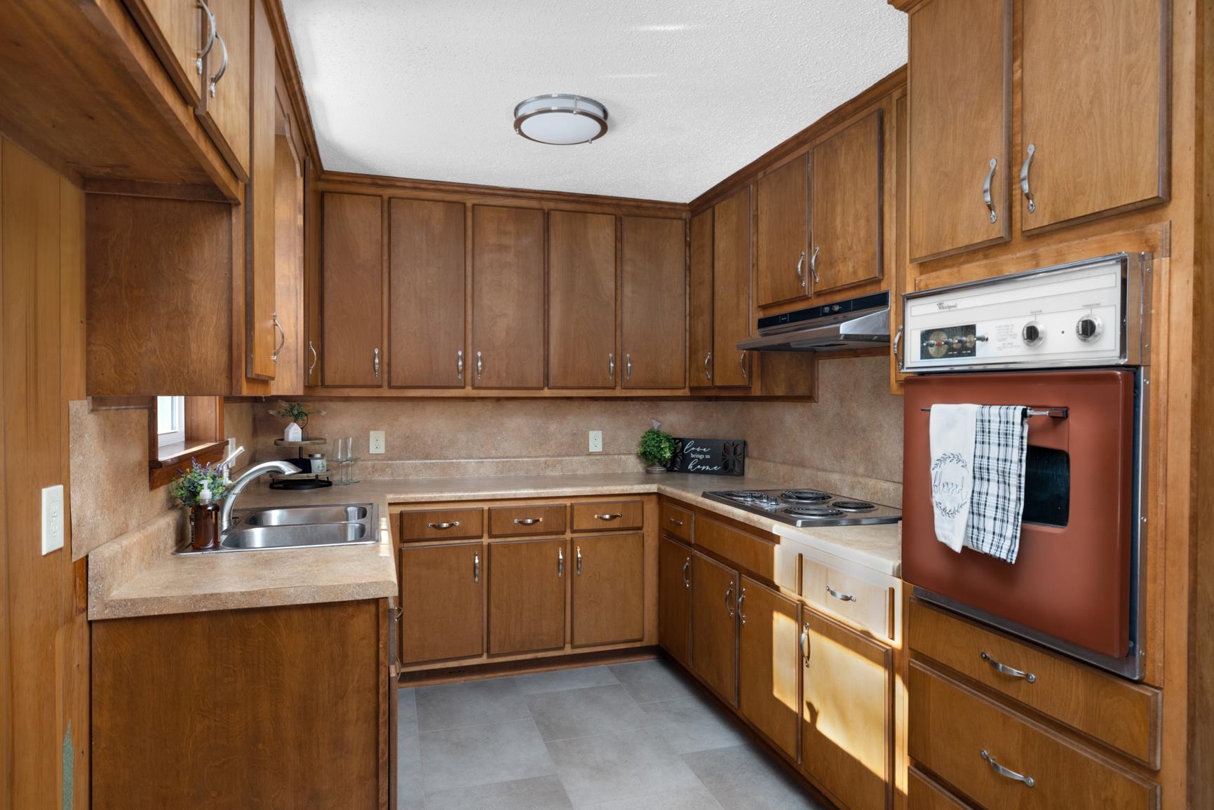 945 Gay Road Burlison, TN 38015 - Photo 15 of 27 a kitchen with stainless steel appliances granite countertop a sink stove and cabinets