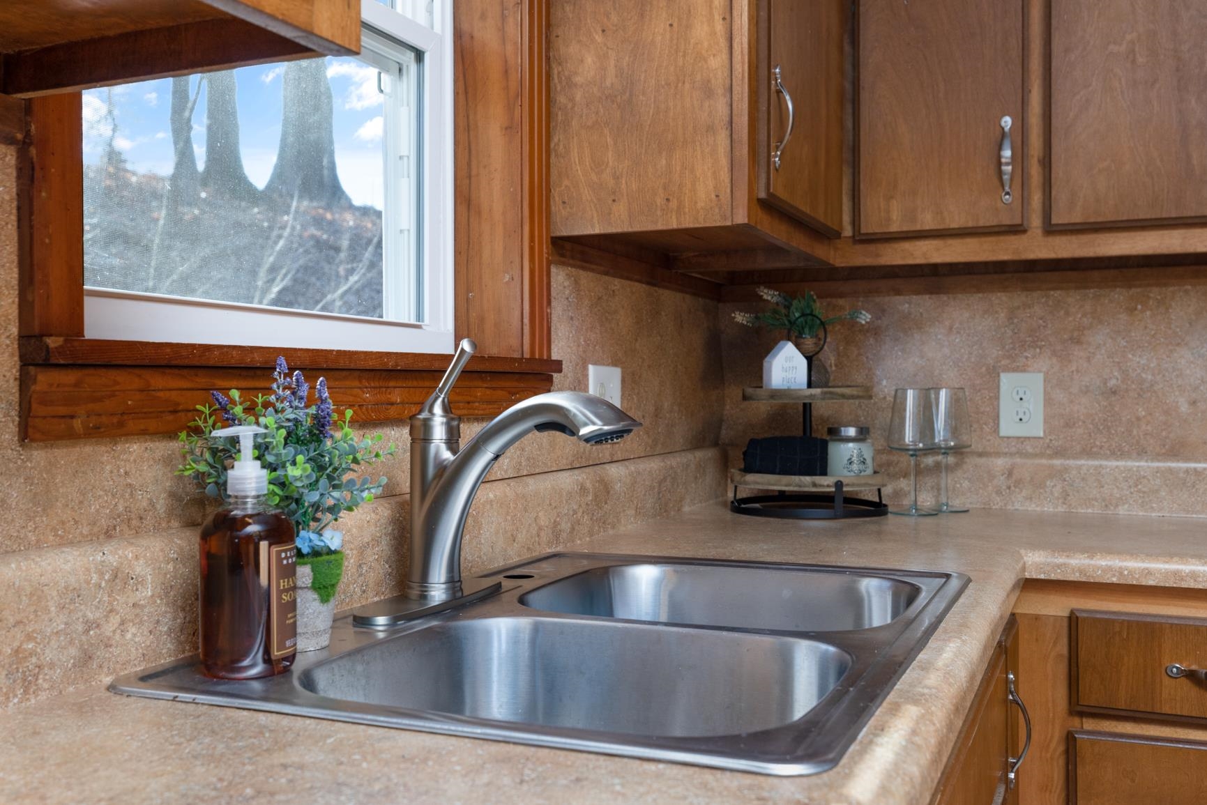 945 Gay Road Burlison, TN 38015 - Photo 17 of 27 a kitchen with granite countertop a sink stainless steel appliances and cabinets
