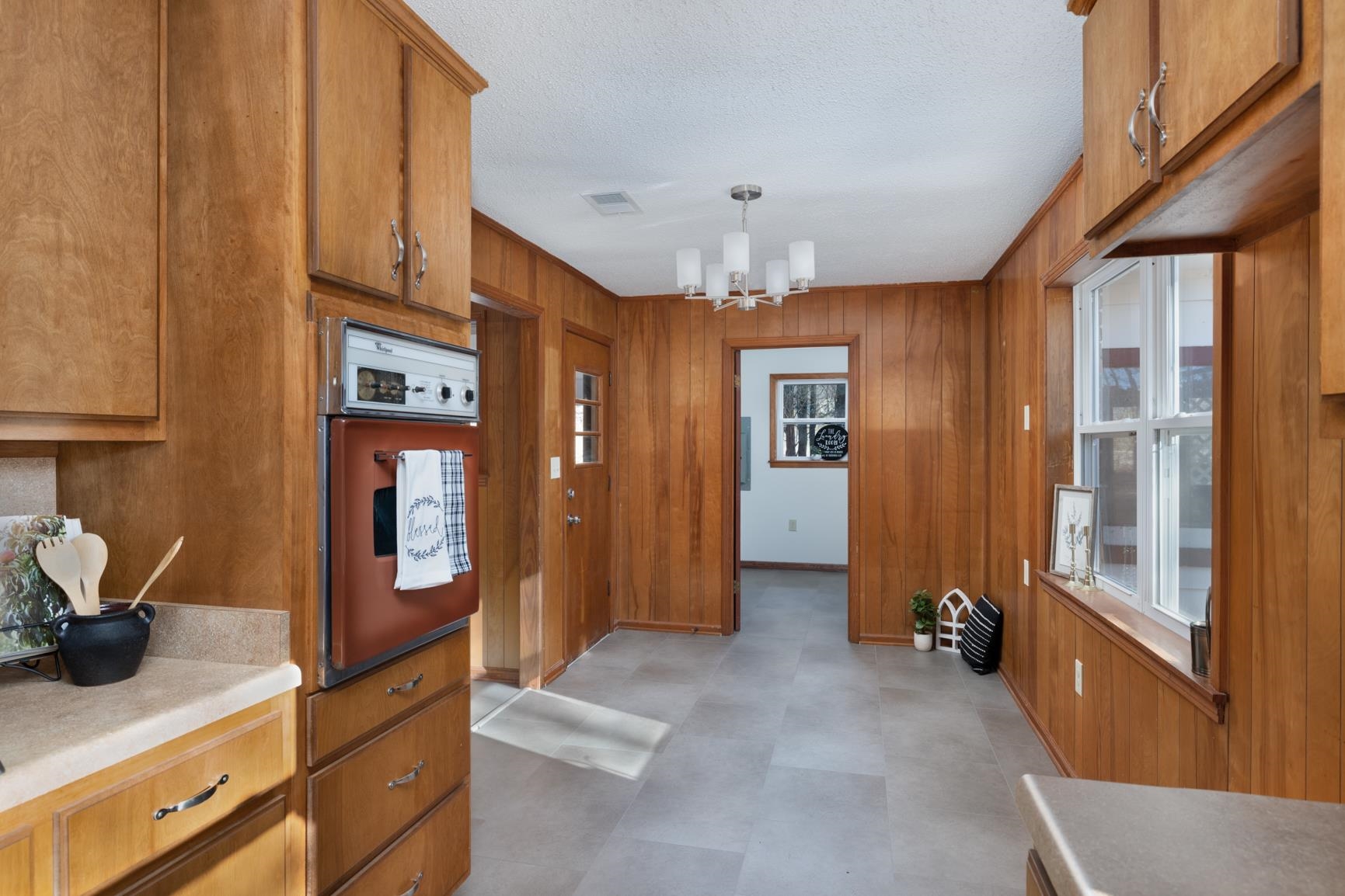 945 Gay Road Burlison, TN 38015 - Photo 19 of 27 a view of a hallway with dining area and chandelier
