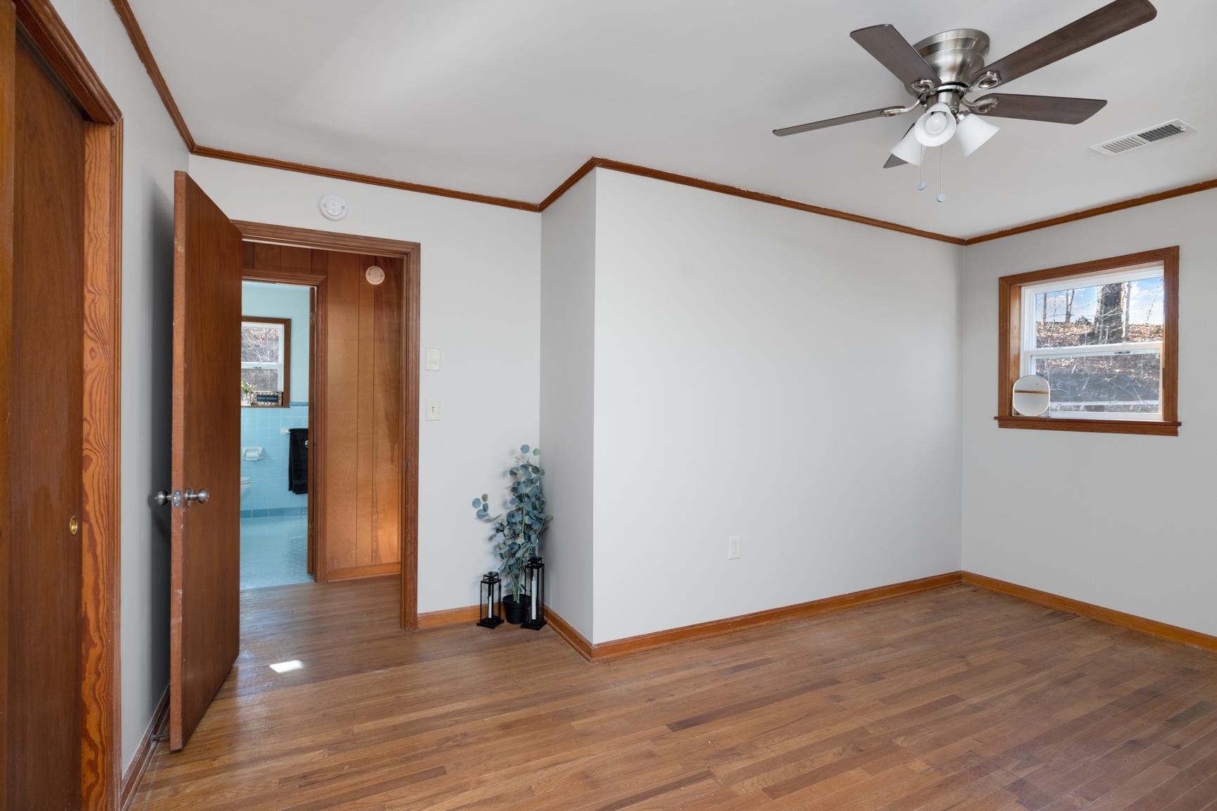 945 Gay Road Burlison, TN 38015 - Photo 22 of 27 a view of an empty room with a fan and a ceiling fan