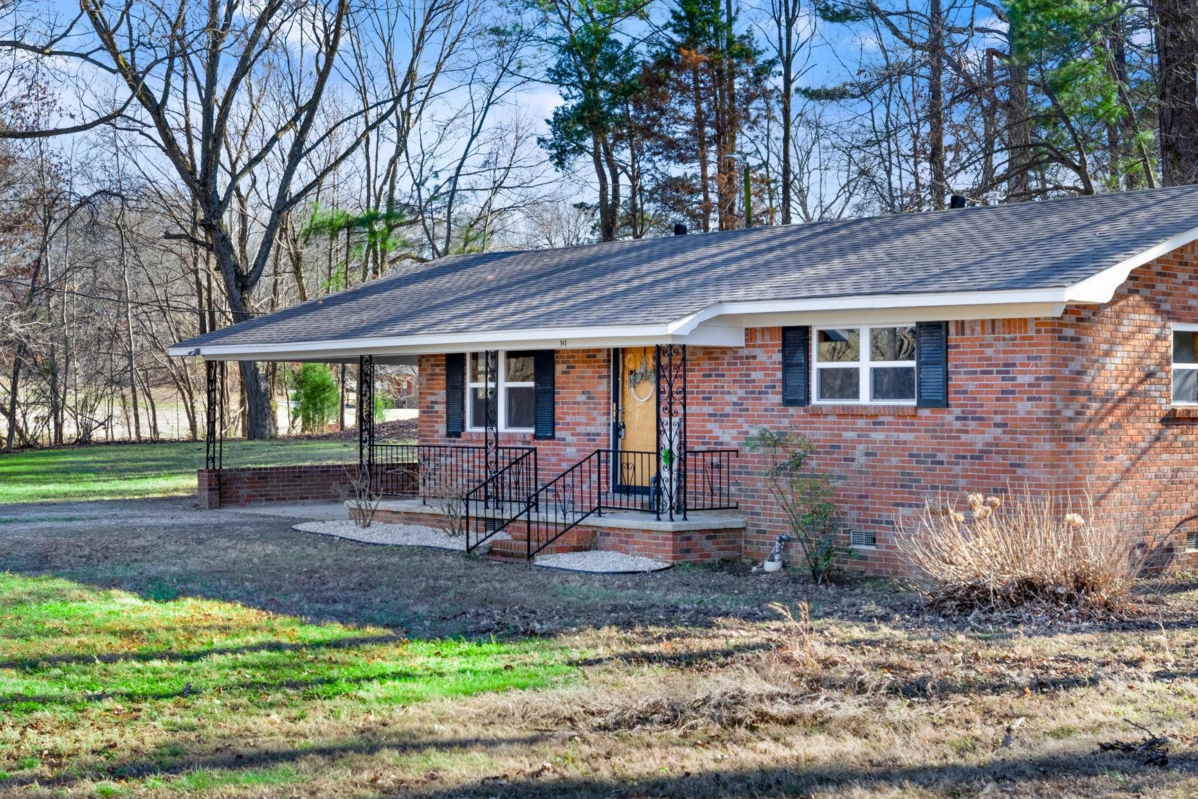 945 Gay Road Burlison, TN 38015 - Photo 6 of 27 a front view of a house with garden