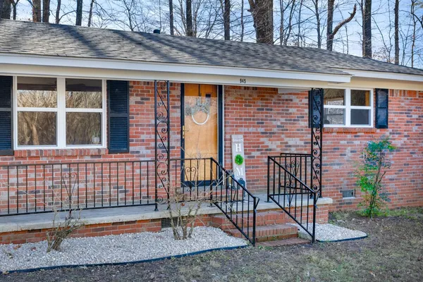 a kitchen with refrigerator cabinets and window