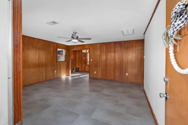 a view of a kitchen with a sink and dishwasher a refrigerator with wooden floor