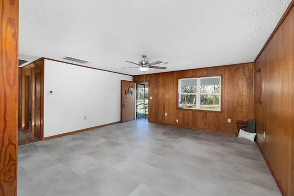 a kitchen with granite countertop a sink stainless steel appliances and cabinets