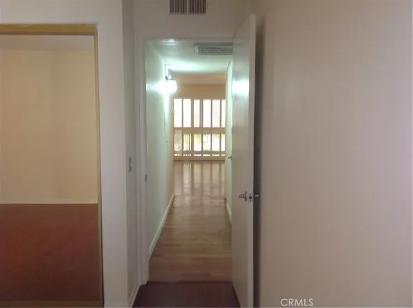 a view of a hallway with windows