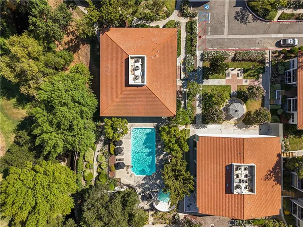an aerial view of a house with yard