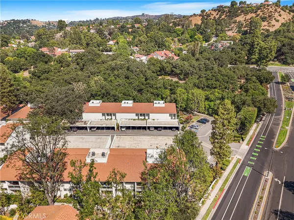 an aerial view of a house with a yard