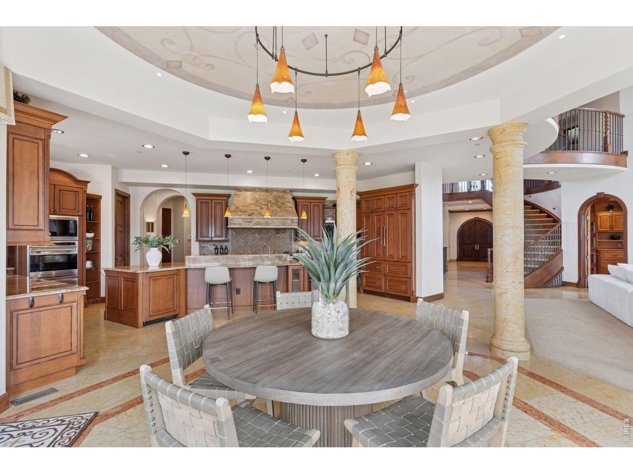 6541 Legend Ridge Trail Niwot, CO 80503 - Photo 11 of 45 a living room with furniture a wooden floor and a fireplace