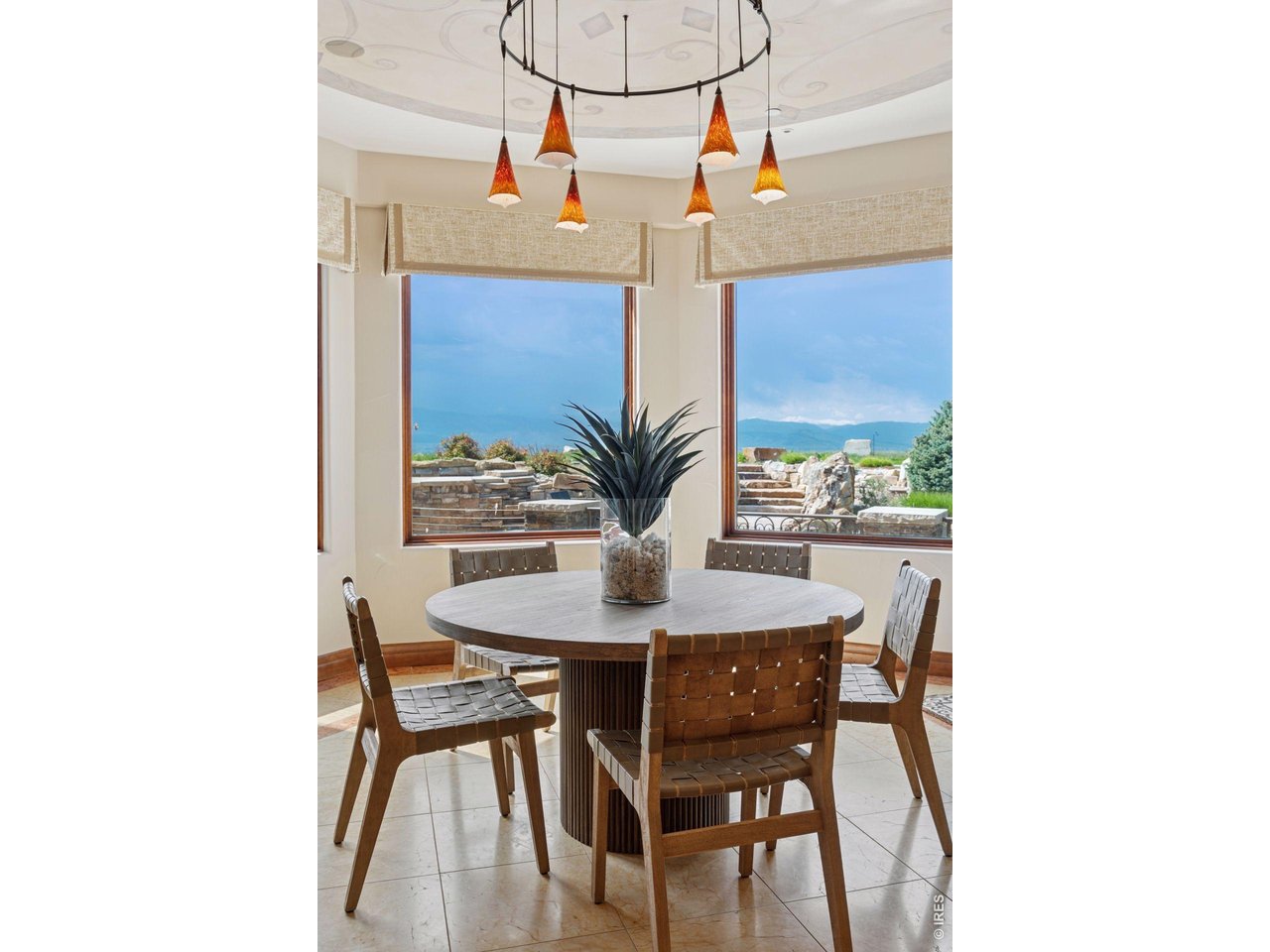 6541 Legend Ridge Trail Niwot, CO 80503 - Photo 15 of 45 a dining room with furniture and wooden floor