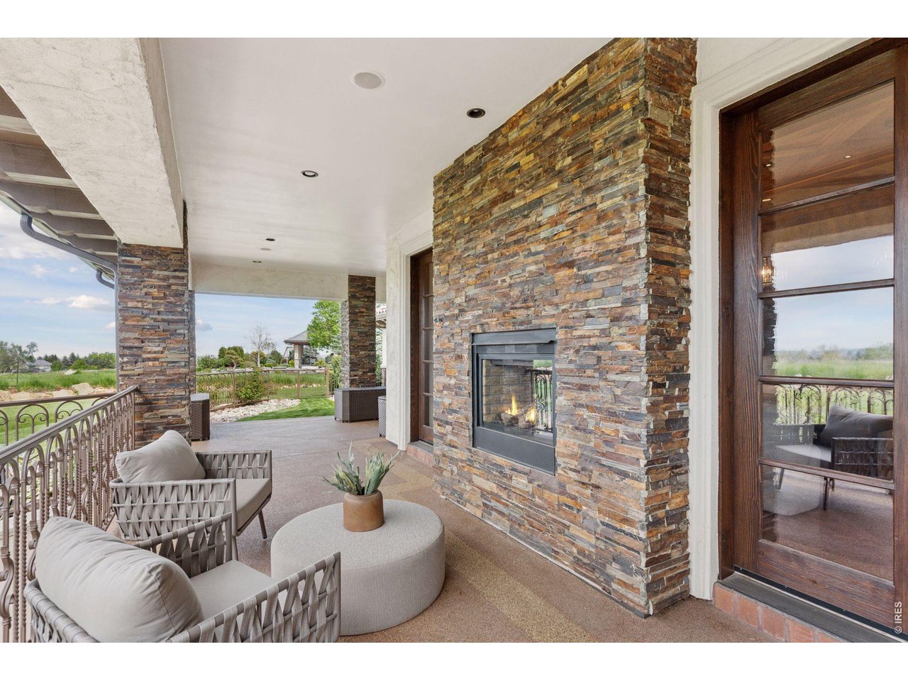 6541 Legend Ridge Trail Niwot, CO 80503 - Photo 20 of 45 a living room with furniture and a fireplace
