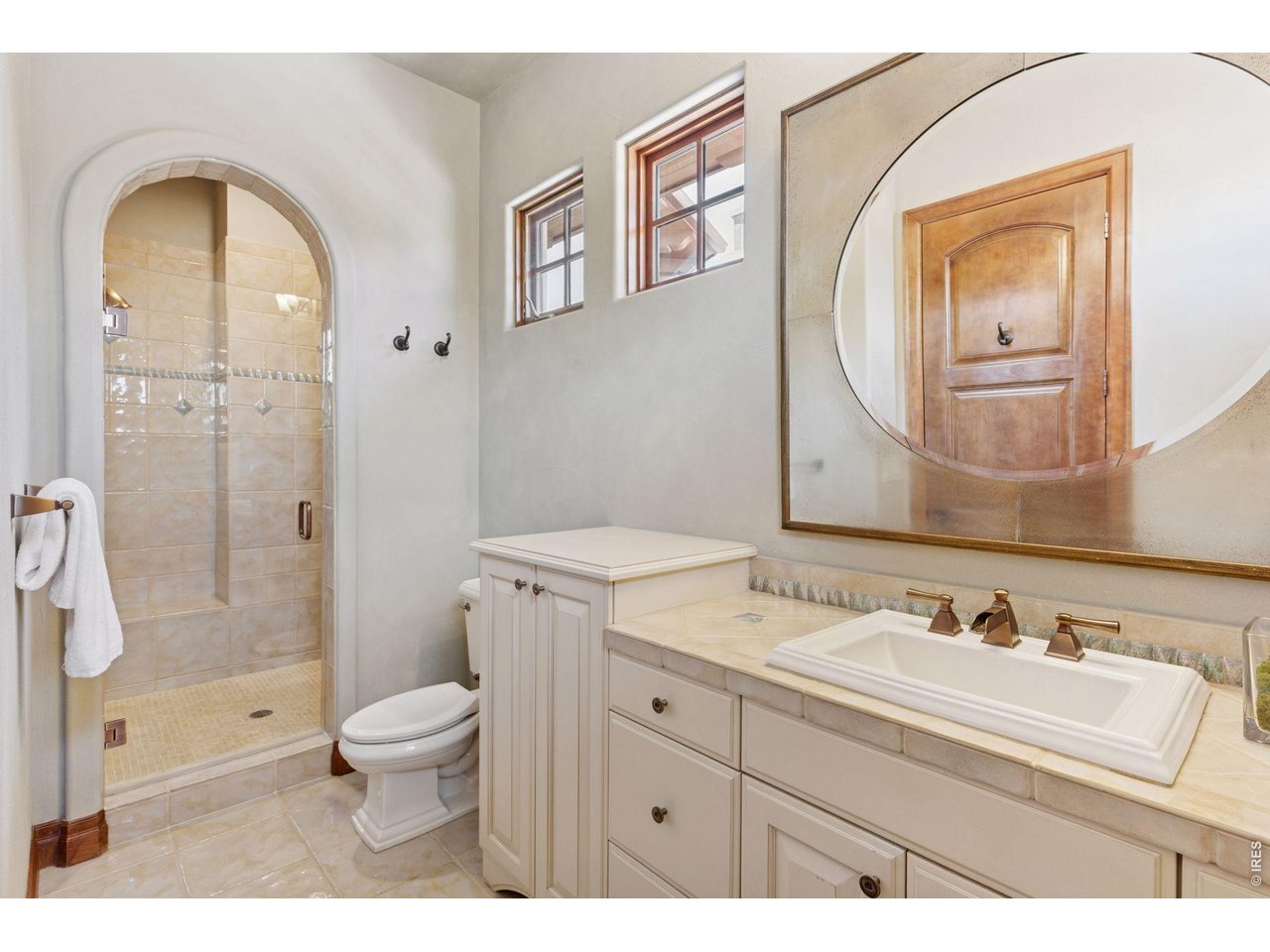 6541 Legend Ridge Trail Niwot, CO 80503 - Photo 29 of 45 a bathroom with a sink a toilet and shower