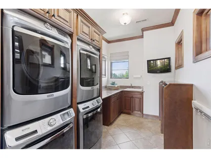 a kitchen with stainless steel appliances kitchen island a stove and a microwave