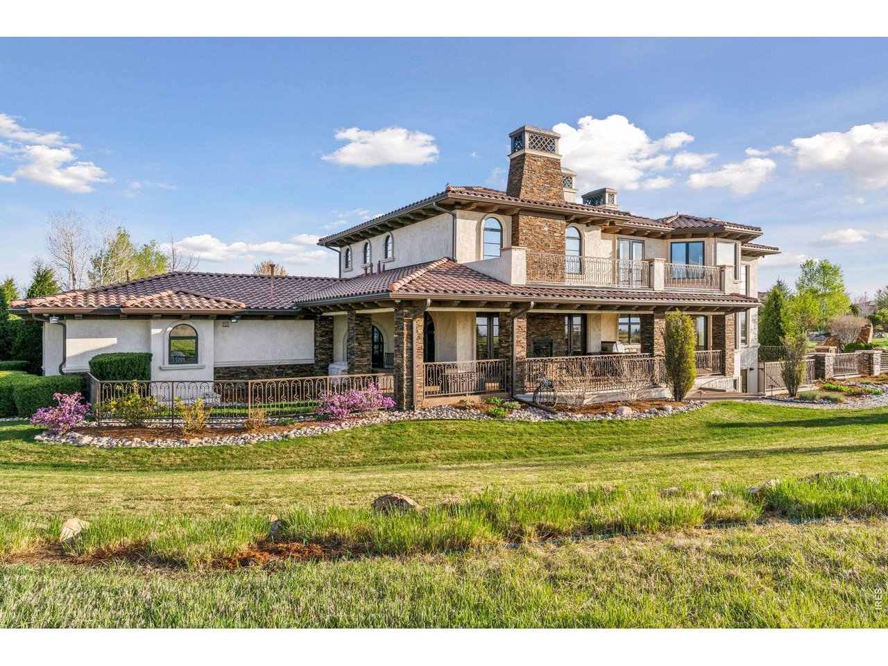 6541 Legend Ridge Trail Niwot, CO 80503 - Photo 42 of 45 a front view of a house with swimming pool having outdoor seating