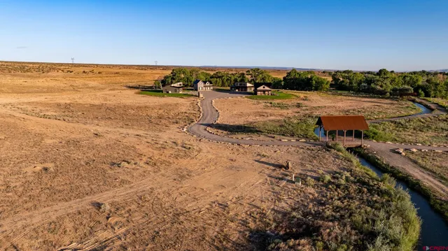 a view of a street with a yard