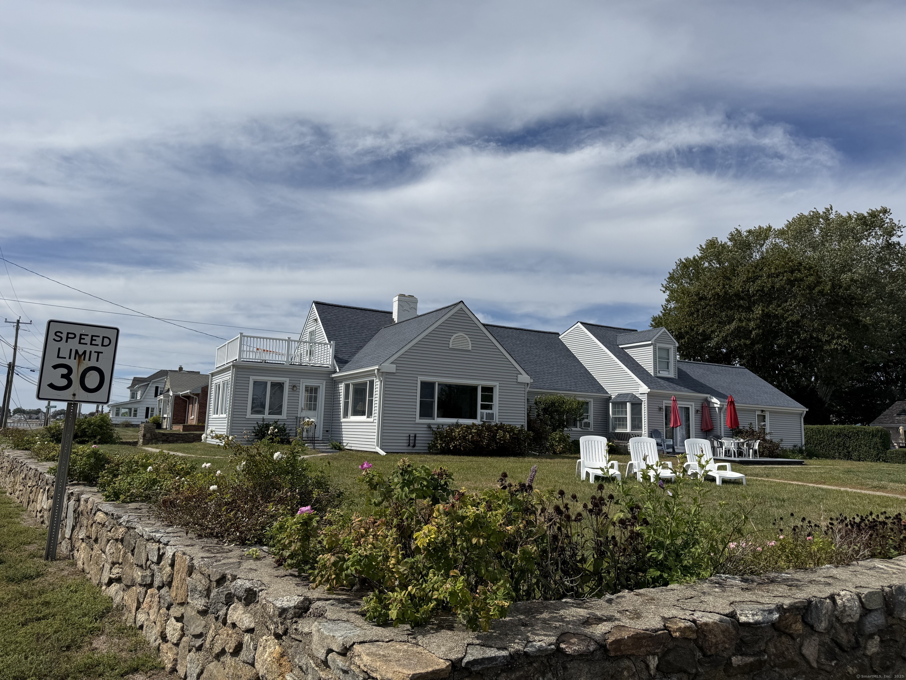 1 Fenwood Drive Old Saybrook, CT 06475 - Photo 12 of 15 a front view of a house with a yard