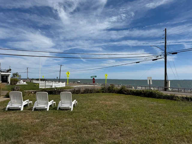 a living room with lots of furniture and clutter