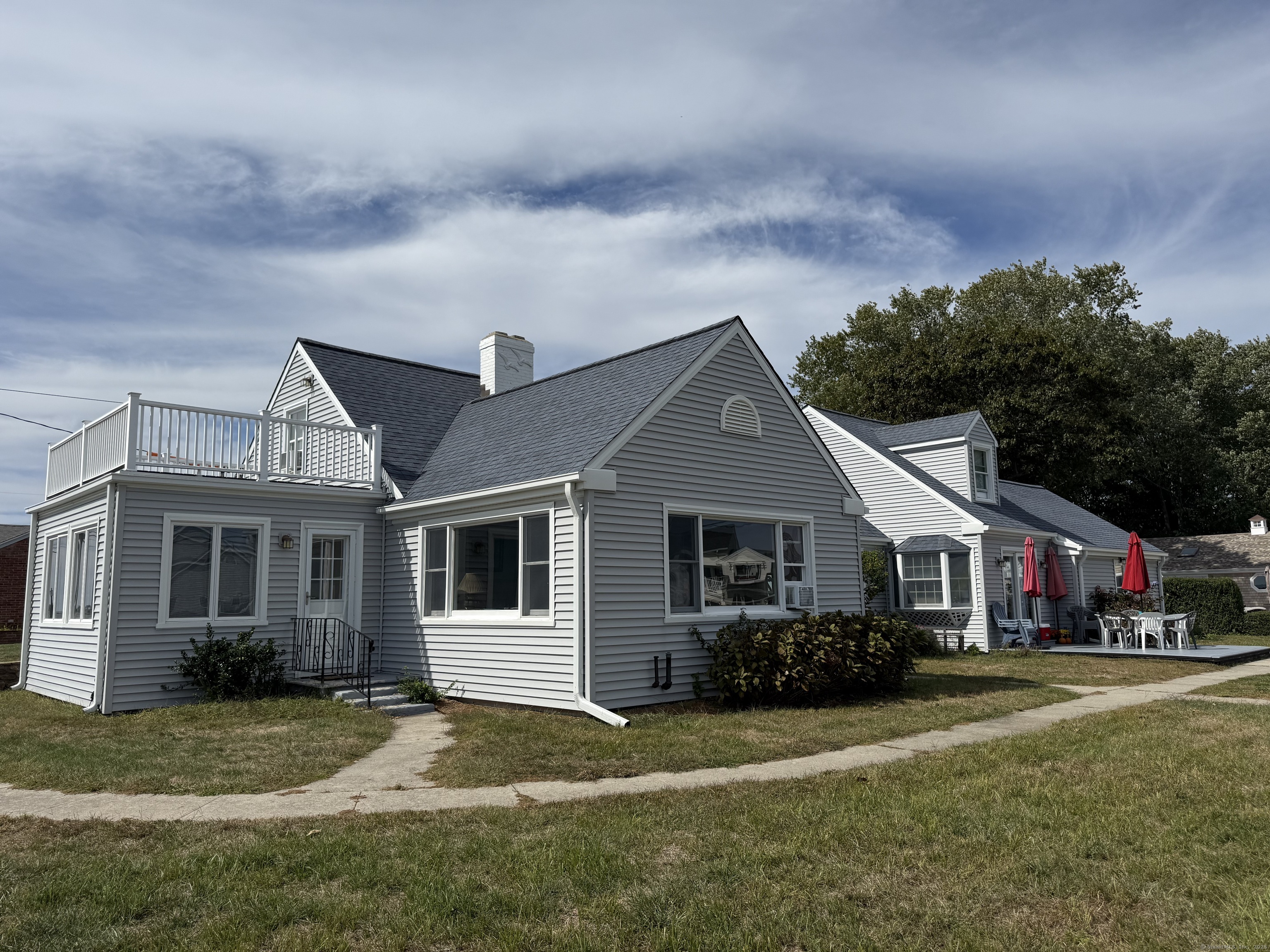 1 Fenwood Drive Old Saybrook, CT 06475 - Photo 2 of 15 a front view of a house with a yard