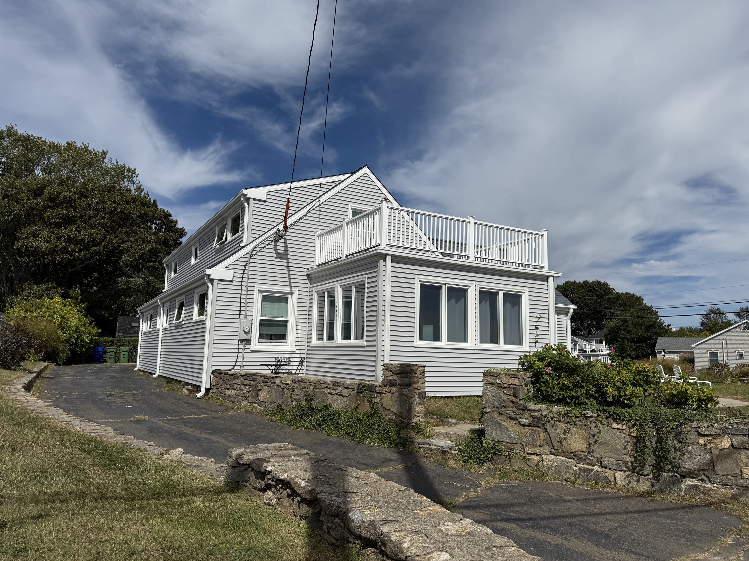 1 Fenwood Drive Old Saybrook, CT 06475 - Photo 4 of 15 a backyard of a house with yard garage and outdoor seating