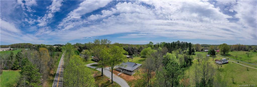 1526 Junction Road Mocksville, NC 27028 - Photo 2 of 28 a view of a city with lush green forest