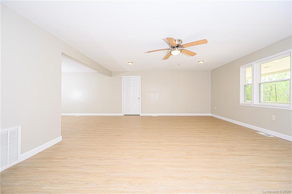 1526 Junction Road Mocksville, NC 27028 - Photo 11 of 28 wooden floor in an empty room with a window