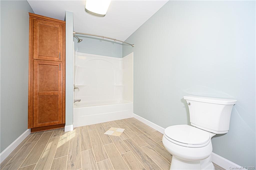 1526 Junction Road Mocksville, NC 27028 - Photo 19 of 28 a bathroom with a toilet and a shower