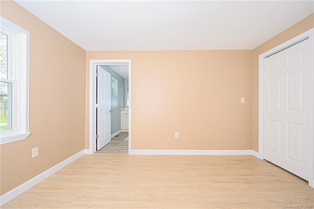 1526 Junction Road Mocksville, NC 27028 - Photo 21 of 28 a view of an empty room with wooden floor