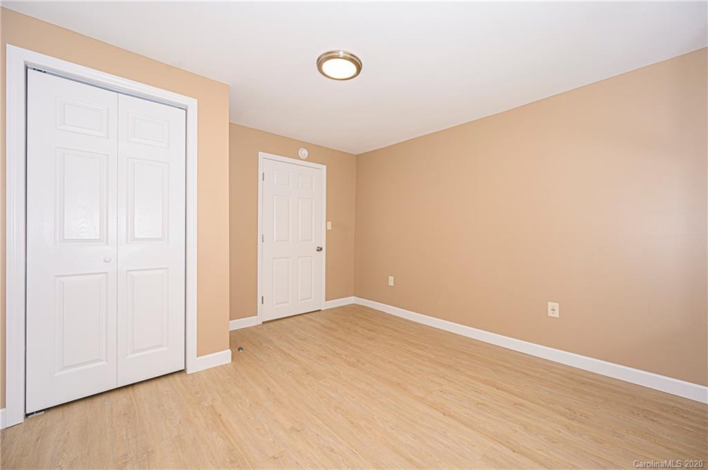 1526 Junction Road Mocksville, NC 27028 - Photo 28 of 28 an empty room with wooden floor and windows