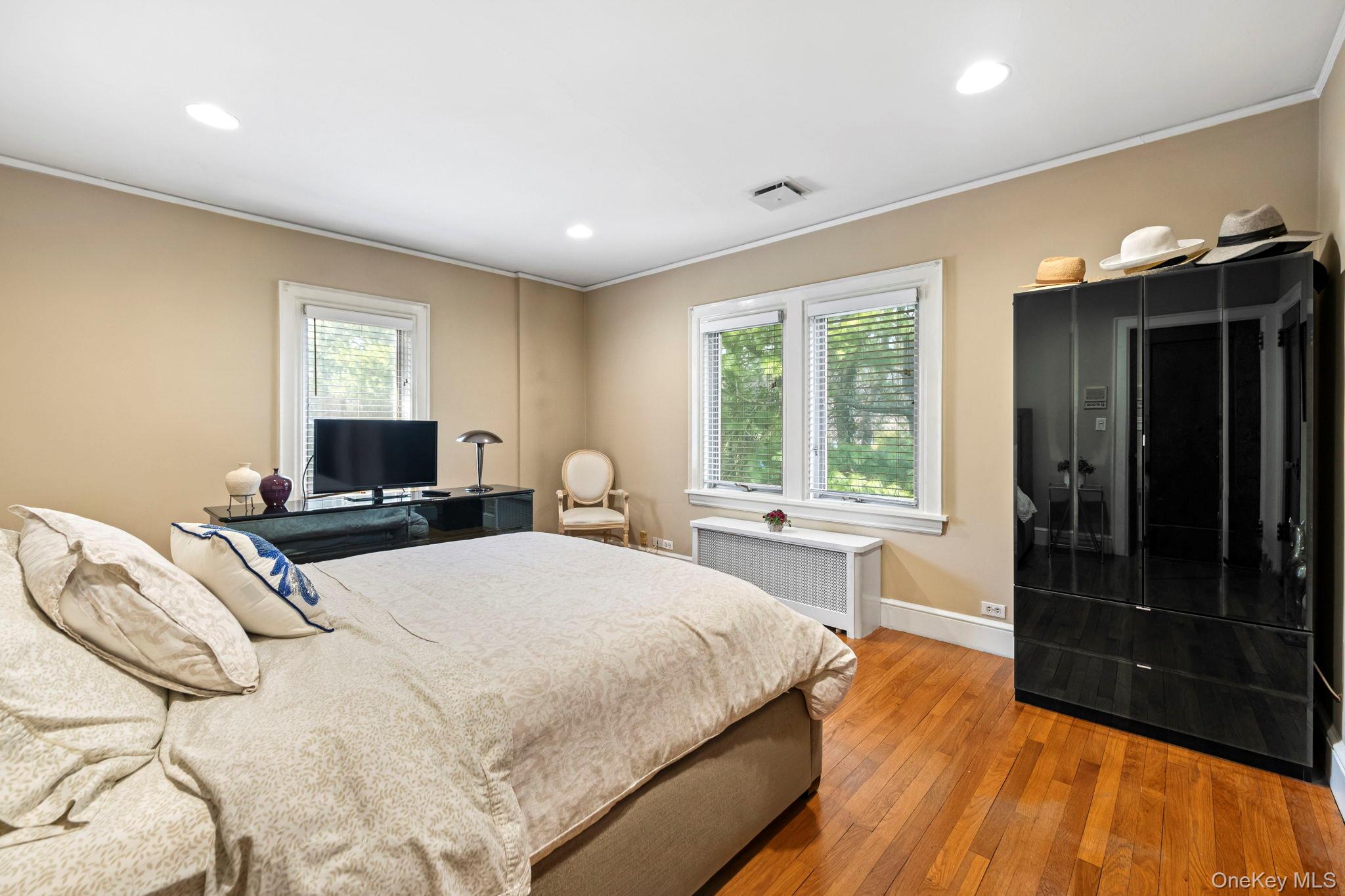 44 Fenimore Road New Rochelle, NY 10804 - Photo 26 of 46 a bedroom with a bed and a window